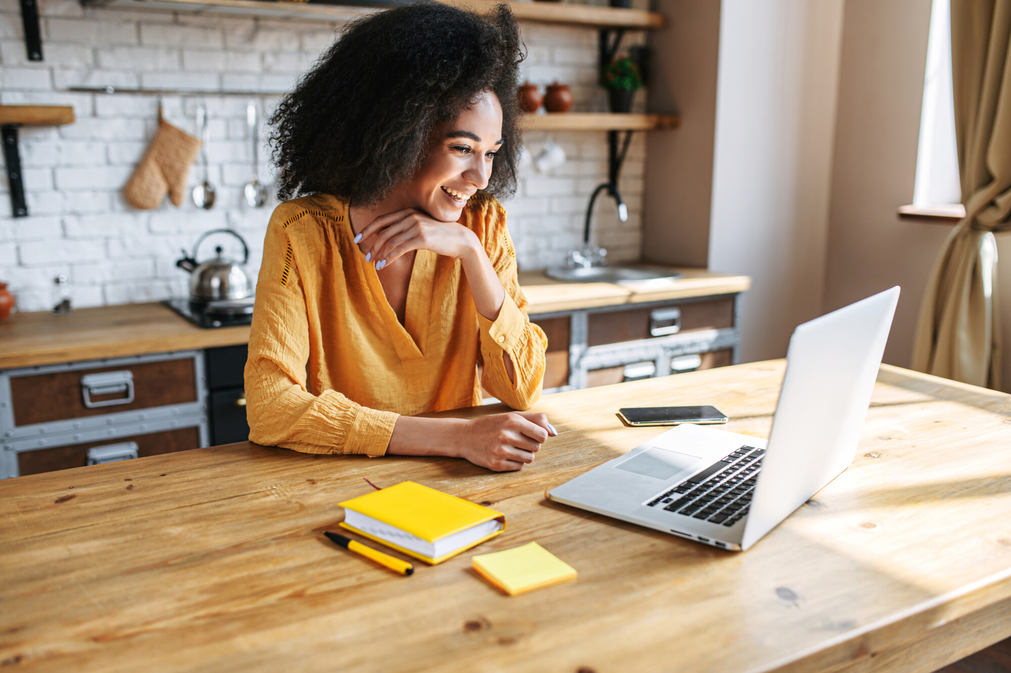 Remote employee on laptop at home